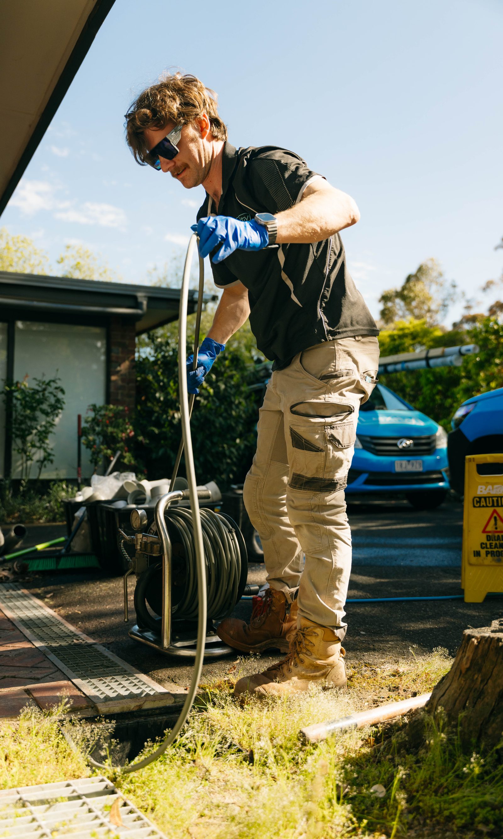 Feeding the drain machine into a blocked outdoor drain